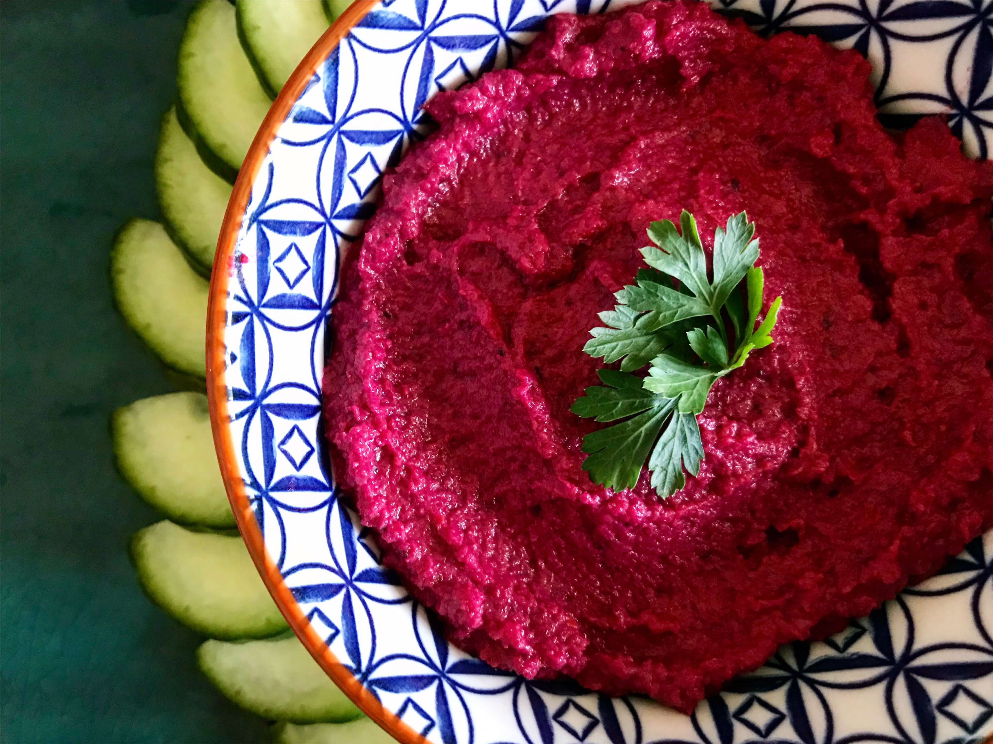 bowl of bright pink beetroot houmous