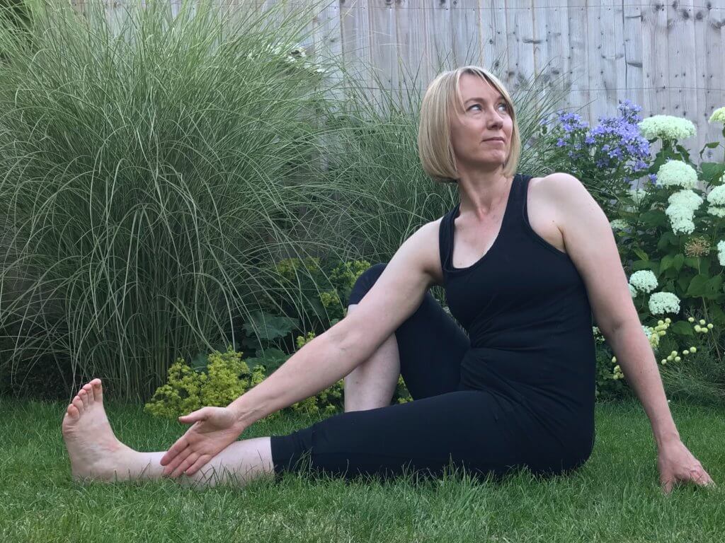 Woman practising twist in yoga